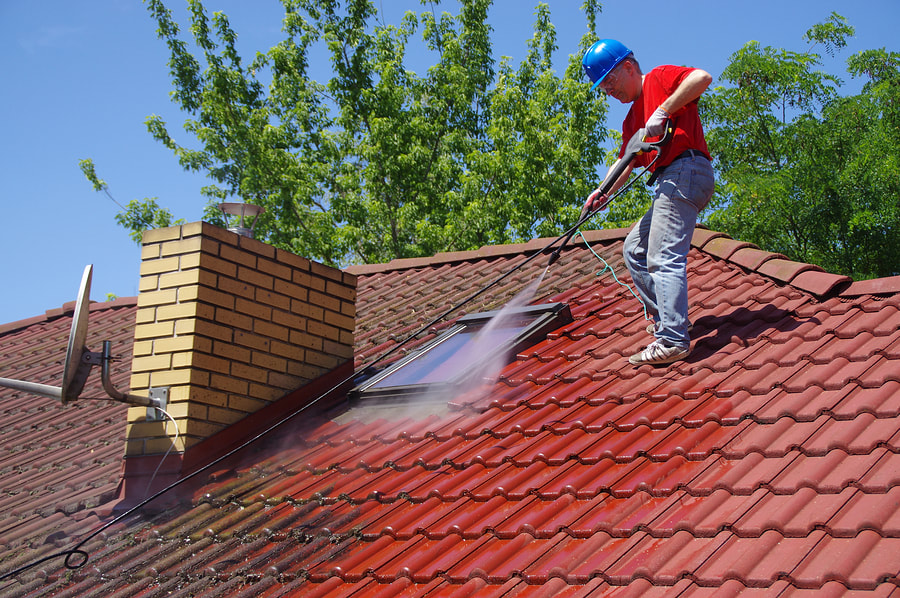 a man cleaning the roof